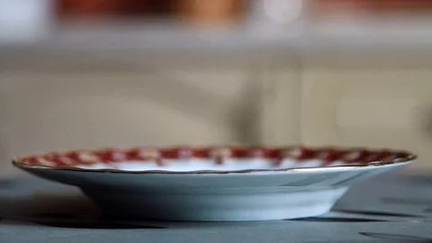 Man puts the bread on a plate close up Stock Footage 71289146