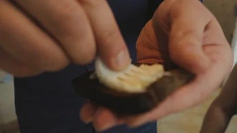 The man puts the cheese on the bread Stock Footage 108386642