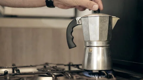 Man puts coffee machine on the kitchen, closeup. Breakfast and beverage concept Video stock 160400924