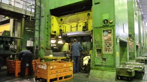 Man puts component under press machine AutoVAZ factory Stock Footage 71829975