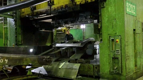 Man puts component under press machine AutoVAZ factory Stock Footage 71973559