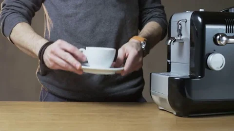 A Man Puts a Cup Into the Coffee Machine Stock Footage 69141220