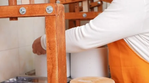 Man puts curd mass under press, cheese making, fermented milk, production Video stock 210149136