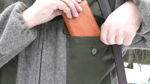 Man puts the documents in his pocket. Stock Footage 151670690