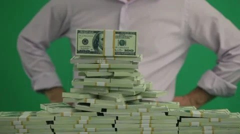 Man Puts Dolars in a Heap Stock Footage 10851038