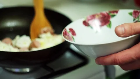 Man puts the eggs in a bowl Stock Footage 70632444