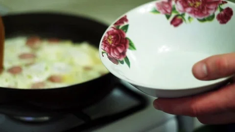 Man puts the eggs in a bowl Stock Footage 70632797