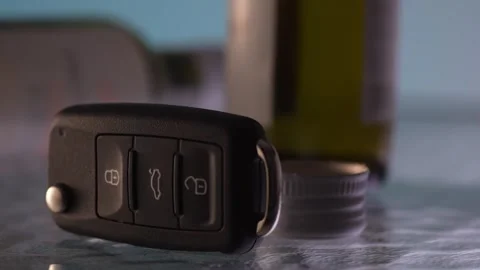 Man puts an empty bottle and takes the car keys. Stock Footage 263755337