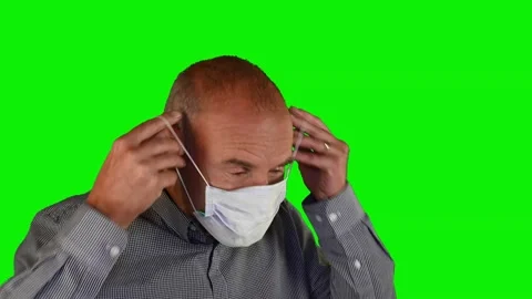 The man puts on a face mask 動画素材 140493791