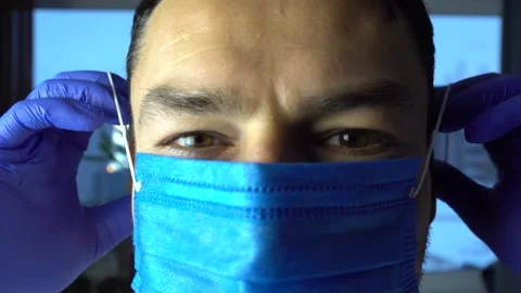 Man Puts On Face Mask Virus Flu Pneumonia Coronavirus Epidemic Pandemic Stock Footage 147546293