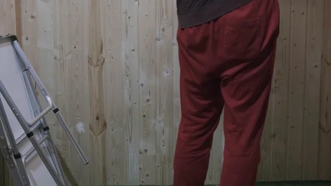 A man puts a folding table in the room Stock Footage 119552177