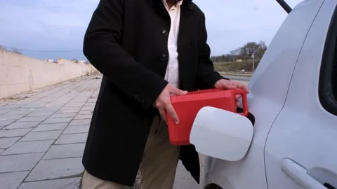 Man puts fuel Stock Footage 237343994
