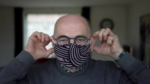 Man puts on funny mask Video stock 144738952