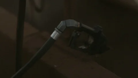 Man puts Gas in Tractor before Work Stock Footage 101972822