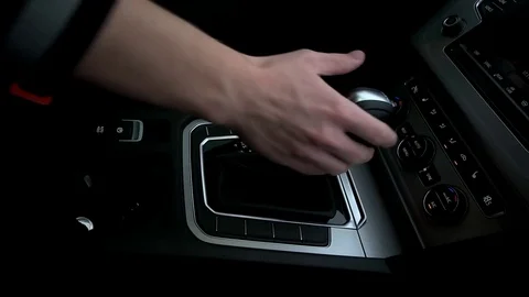 Man puts the gearbox into drive mode Stock Footage 73941783