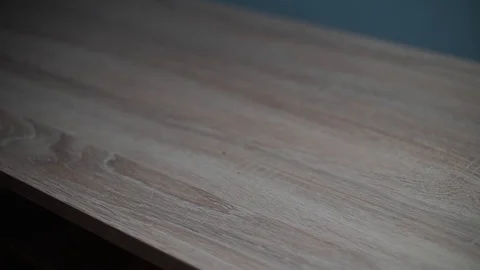 Man puts hamburger on the table Stock Footage 128416678