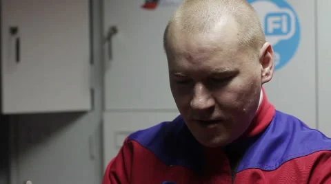 Man puts on helmet Stockbeeldmateriaal 64206495