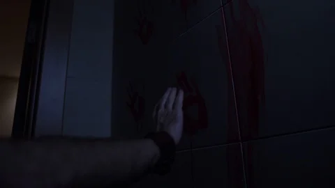 Man puts his hand on a red palm on a white wall in the room, and then removes it Stock-Footage 111860677