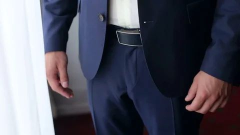 Man puts his hands in his pockets blue pants. CU Stock Footage 81767016