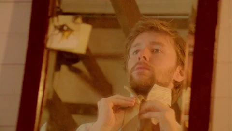 Man puts his tie on in the Mirror Stock Footage 272393502