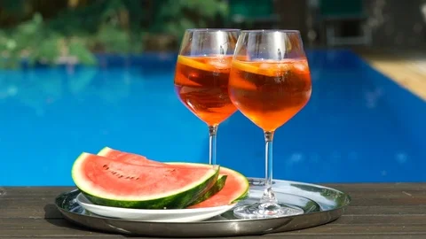 Man puts ice cubes into the glass of cocktail Stock Footage 112426940