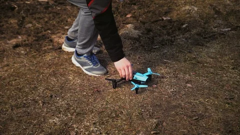 A man puts it on the ground and prepares for Stock Footage 97410755