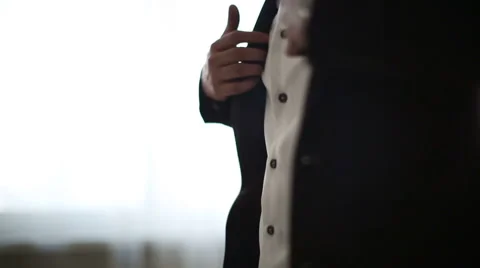 Man puts on a jacket Stock Footage 46178441