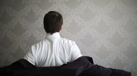 The man puts on a jacket Stock Footage 46178500