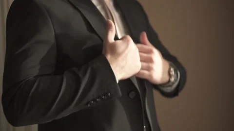 A man puts on a jacket Stock Footage 168008721