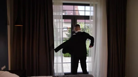 The man puts on a jacket Stock Footage 172138781