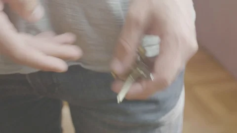 Man puts keys in his pocket Video stock 96169828
