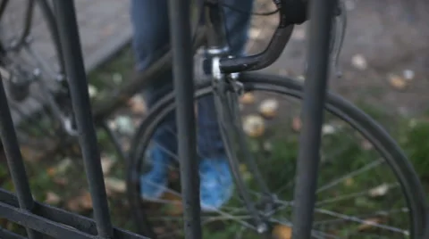 Man puts the lock on the bike Stock Footage 54286284