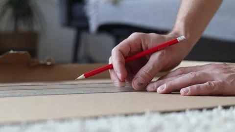 Man puts marks on a sheet of paper. Stock Footage 280306477