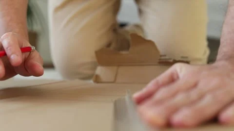 Man puts marks on a sheet of paper. Stock Footage 280306490