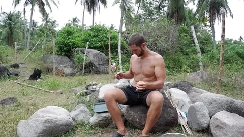 A man puts meat on a stick. Video stock 158849070