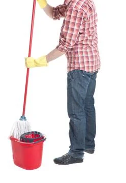 Man puts the mop in a bucket Stock Photos