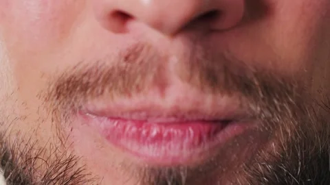 The man puts the mouth guard close up footage. Dental trainer for adults for the Stock Footage 312446828