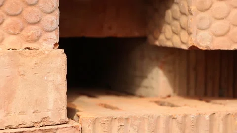 A man puts old letters between red bricks Stock Footage 254982057