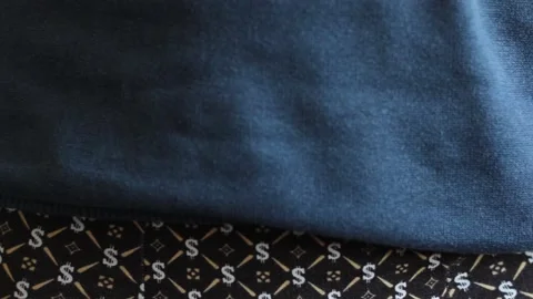 Man puts on pants. Close-up. Stock Footage 130638645