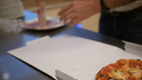 Man puts pieces of bacon on the hot pizza. Italian food in takeout box 스톡 동영상 99003492