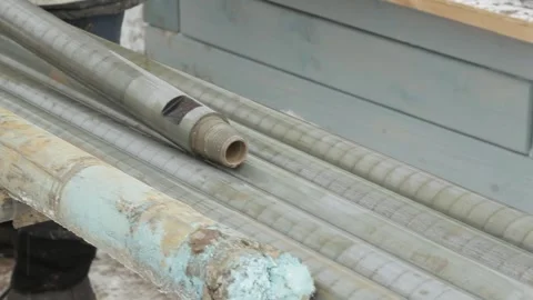 A man puts pipes together Stock Footage 145518239