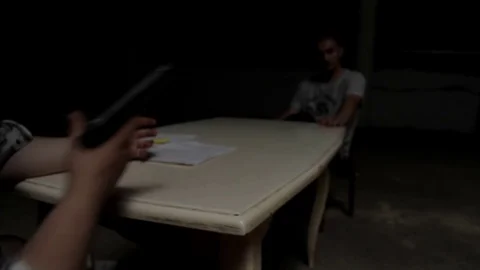 Man puts pistol on the table Stock Footage 71575627
