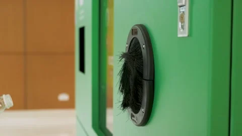Man puts plastic bottle in a reverse vending machine. Male hand inserting Stock Footage 279011463