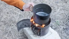 Traditional Cuisine Big Black Pot Cooking Food, Natural Fire With Wood  Heating Stock Photo, Picture and Royalty Free Image. Image 91283660.