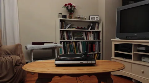Man Puts Record on Turntable Video stock 61441022