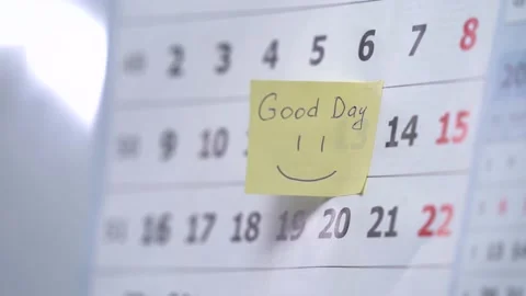 Man puts a reminder of an important event on the calendar Stock Footage 154252885