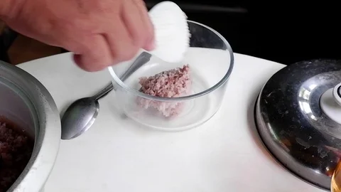 Man puts rice in a plate Video stock 122157510