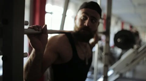 Man puts the ring on the barbell in the gym Stock Footage 56635845