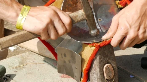 Man puts a rivet on a piece of plate armor Stock-Footage 123583680