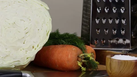 A man puts salt and a vegetable cutter Stock Footage 121661309